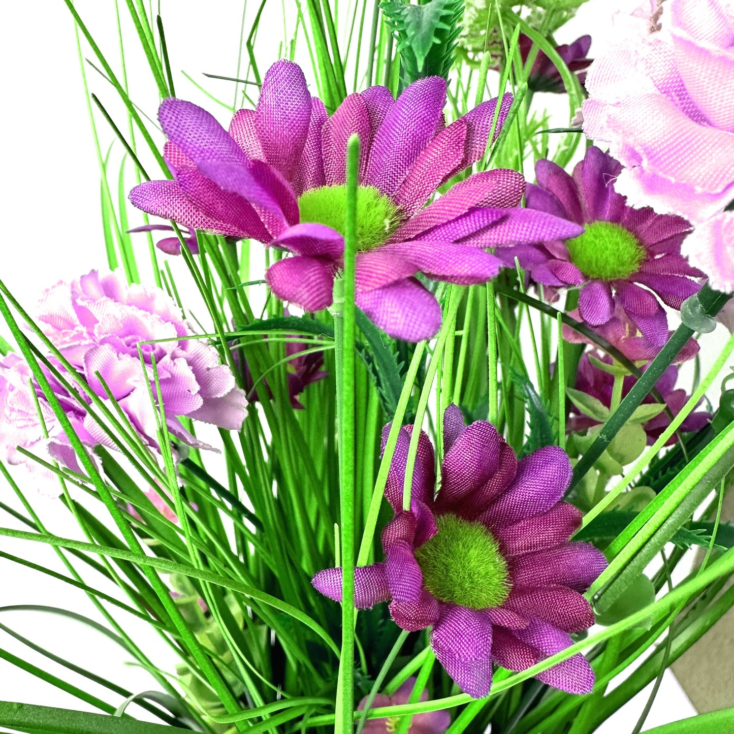 Artificial Grass, Purple Carnations and Wild Flower Arrangement 57cm